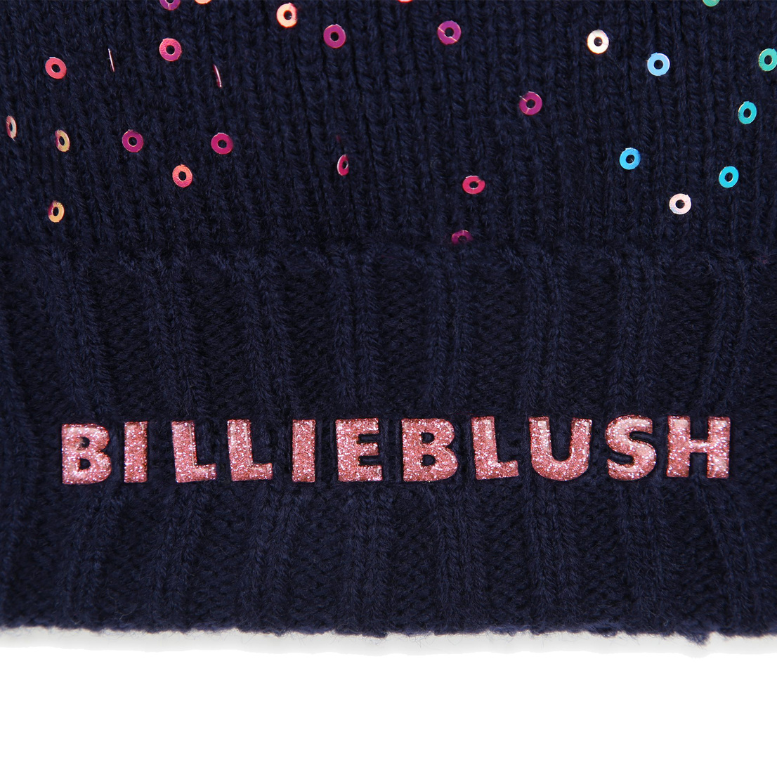 Beanie with faux-fur bicolor pompom. Sequins on ac