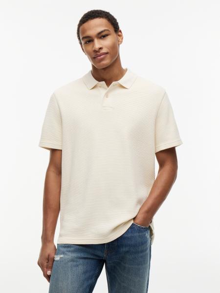 Afbeelding voor product Polo van het merk Tommy Jeans in het Beige