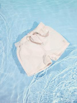 Afbeelding voor product Zwembroek van het merk Name It in het Beige